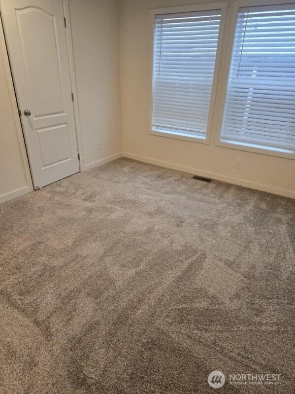 1011 N 34th Ave Unit 59, Yakima, WA 98902 - carpeted empty room featuring baseboards
