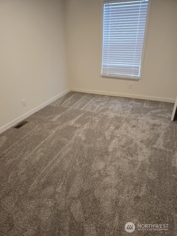 1011 N 34th Ave Unit 59, Yakima, WA 98902 - empty room featuring carpet flooring and baseboards
