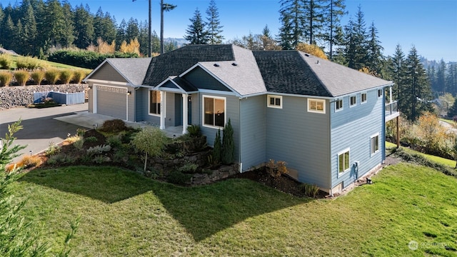 view of front of home with a garage and a front yard