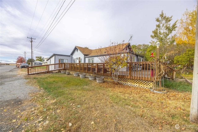 view of yard featuring a wooden deck