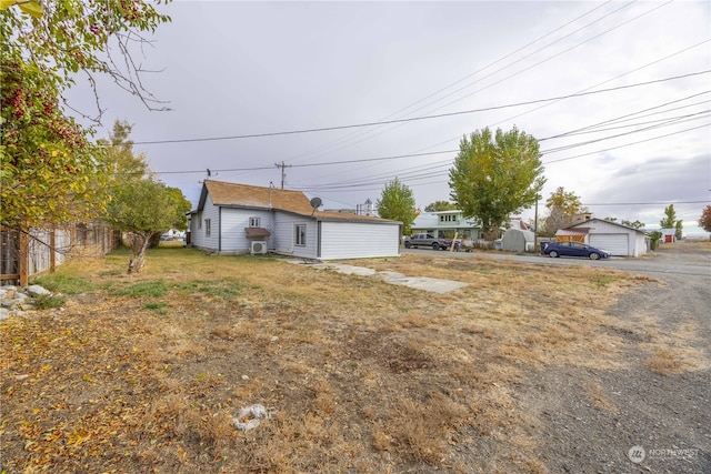 view of front of home with an outbuilding and a garage