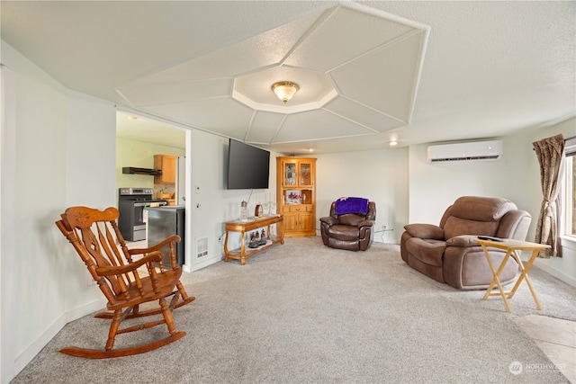 living area featuring carpet flooring and a wall mounted AC