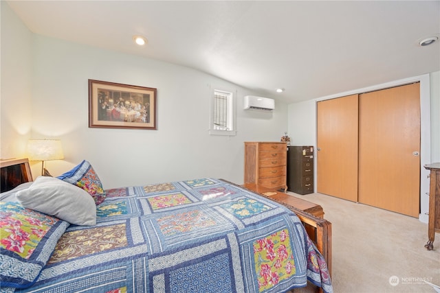 carpeted bedroom with a closet and a wall mounted air conditioner