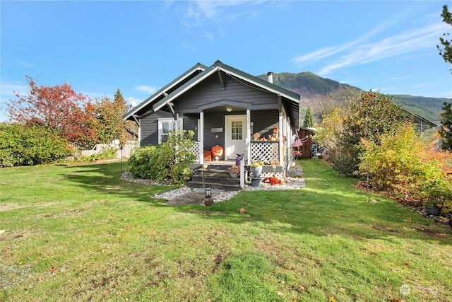 730S Emens Ave, Darrington, WA 98241 - view of front facade featuring a porch, a front yard, and a mountain view