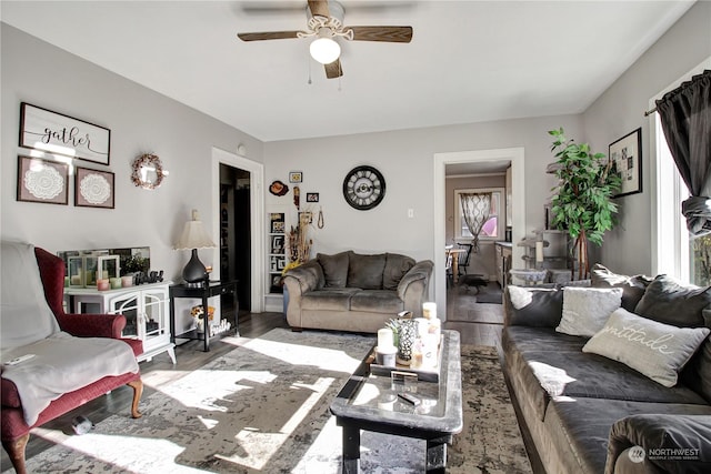 living room with hardwood / wood-style floors and ceiling fan