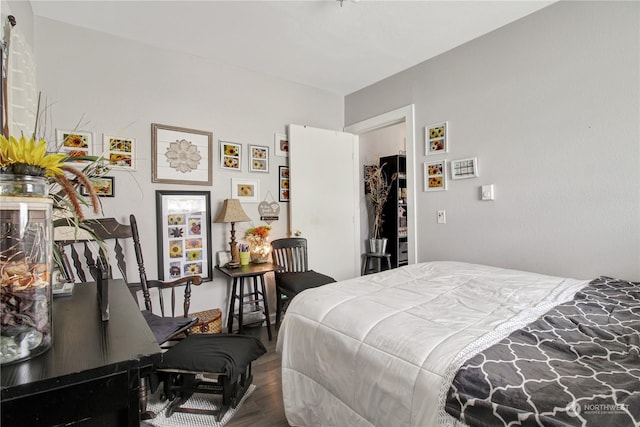 bedroom with hardwood / wood-style flooring