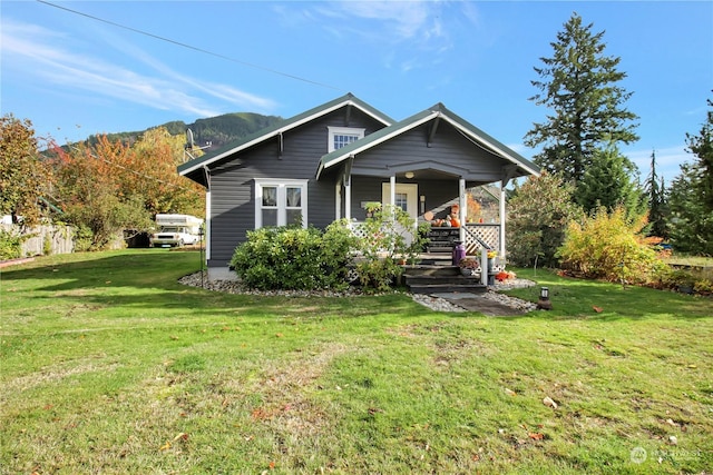 730S Emens Ave, Darrington, WA 98241 - bungalow featuring covered porch, a front yard, and a mountain view