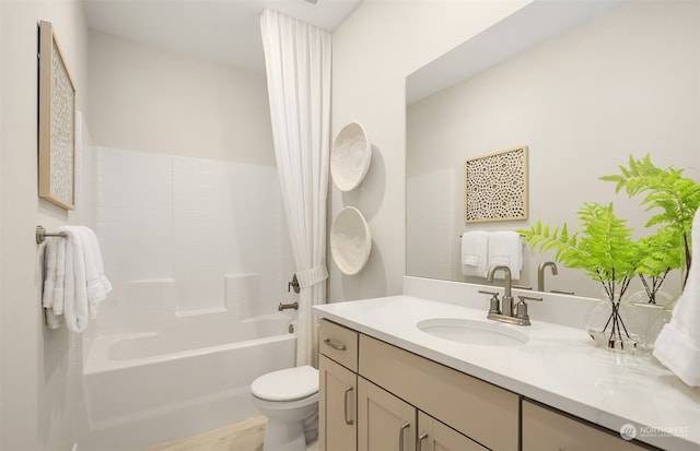 full bathroom featuring vanity, toilet, and shower / tub combo with curtain