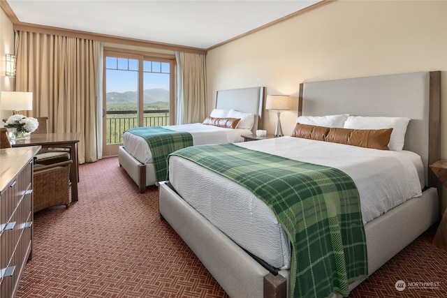 carpeted bedroom featuring access to outside, a mountain view, and ornamental molding