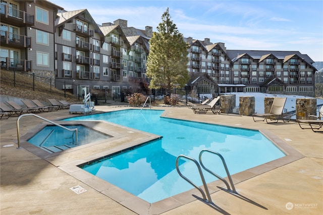 view of swimming pool featuring a patio area