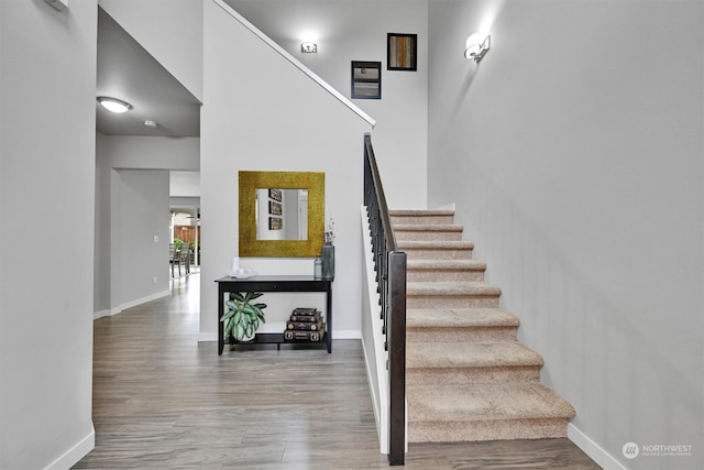 stairs with wood-type flooring