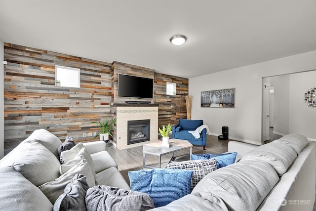 living room with wood walls and hardwood / wood-style floors