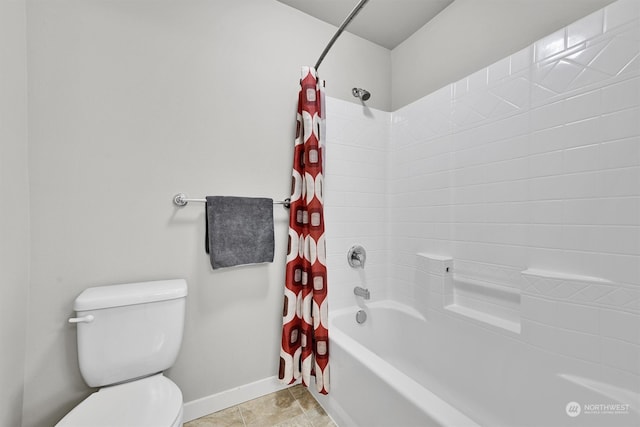 bathroom featuring shower / tub combo and toilet