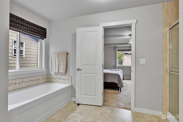 bathroom with separate shower and tub and ceiling fan