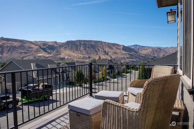 balcony featuring a mountain view