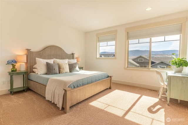 carpeted bedroom featuring a mountain view