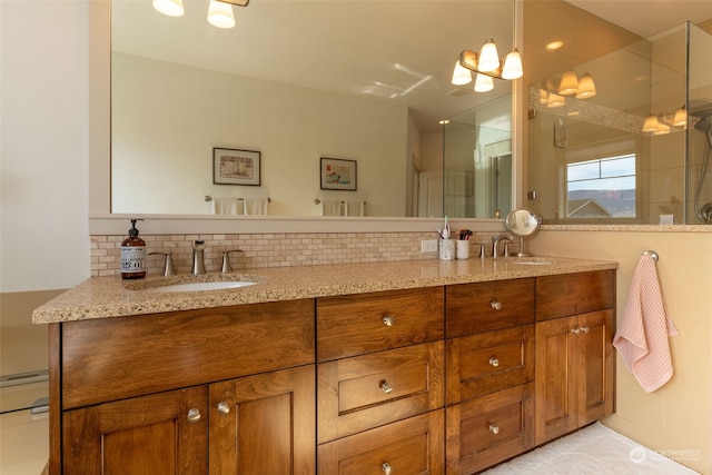 bathroom with walk in shower, vanity, and decorative backsplash