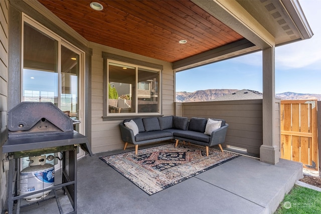 view of patio with a mountain view and an outdoor living space