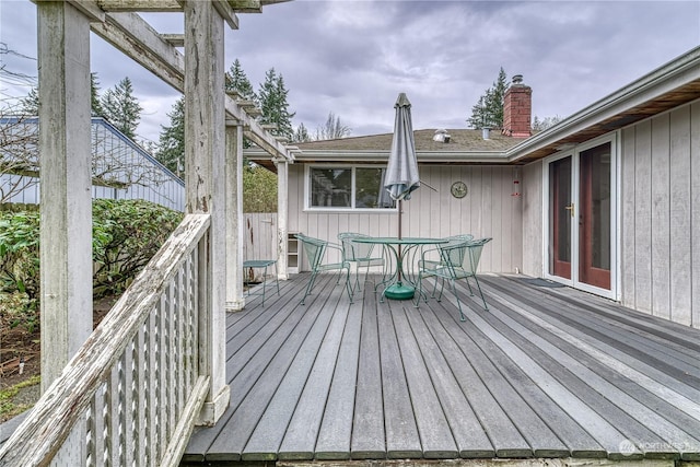 deck with outdoor dining area