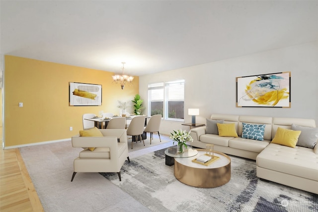 living room featuring light hardwood / wood-style flooring and a chandelier