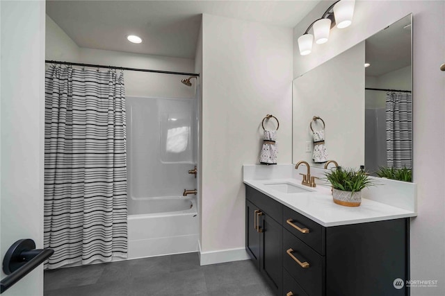 bathroom featuring vanity and shower / bath combination with curtain