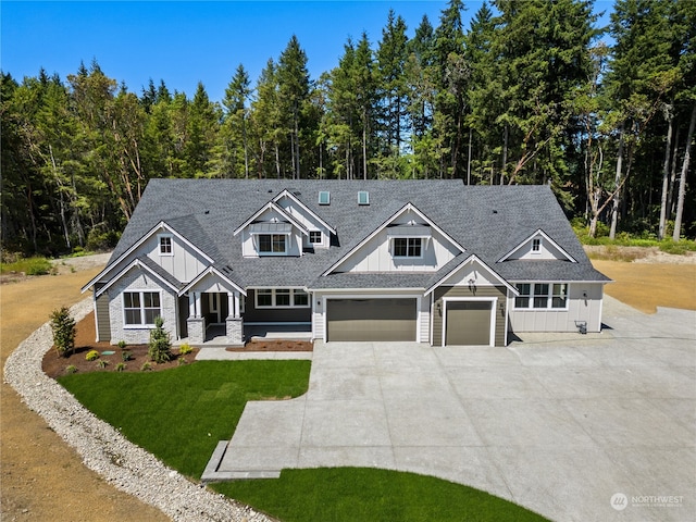 craftsman-style house with a garage and a front yard