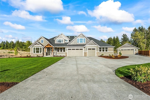 25709 64th Avenue Ct E Unit 7, Graham, WA 98338 - craftsman inspired home featuring stone siding, a front yard, concrete driveway, and covered porch