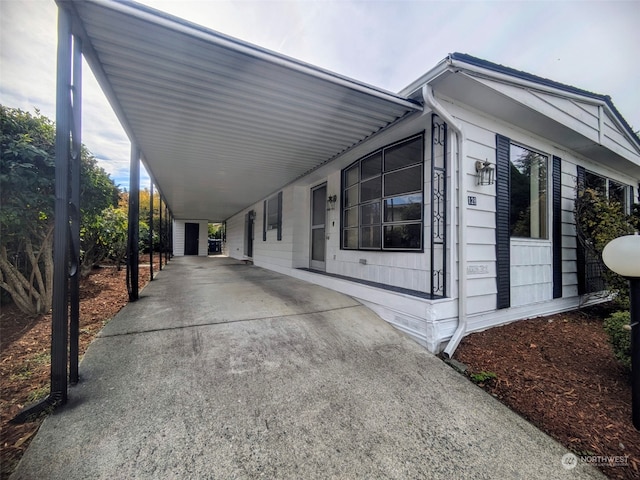 view of home's exterior with a carport