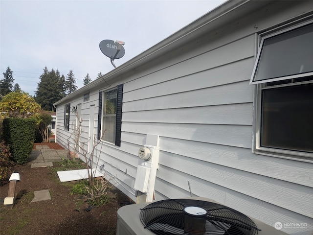 view of side of home with cooling unit