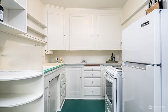 kitchen with white appliances and white cabinetry