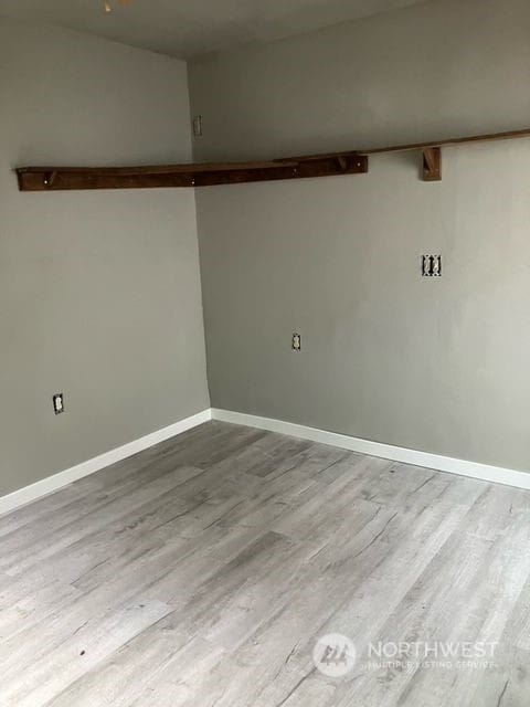 spare room with light hardwood / wood-style flooring