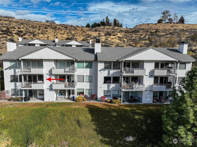 view of building exterior featuring a mountain view