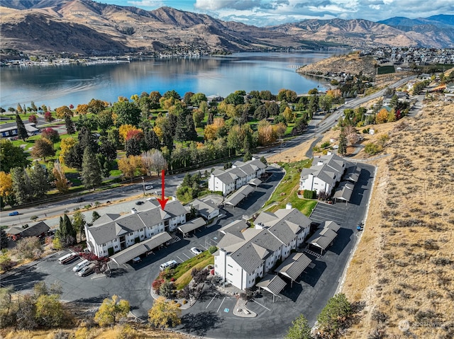 bird's eye view with a water and mountain view