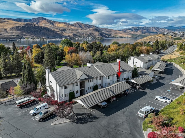 drone / aerial view of a water and mountain view