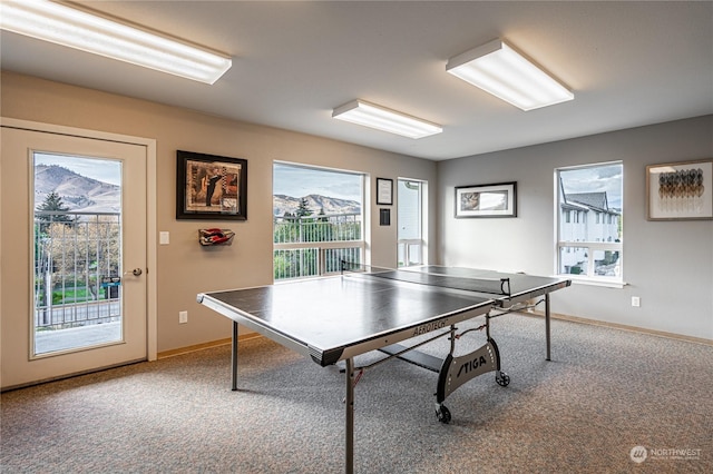 playroom with healthy amount of natural light, carpet, and baseboards
