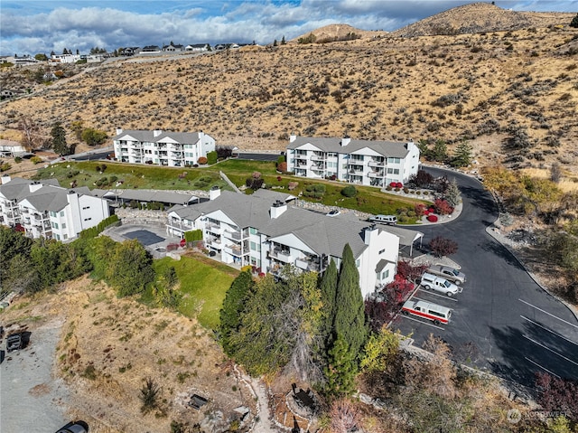 drone / aerial view featuring a mountain view