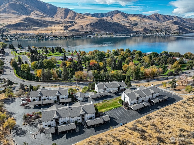 bird's eye view with a water and mountain view