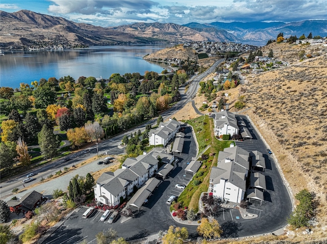 birds eye view of property featuring a water and mountain view