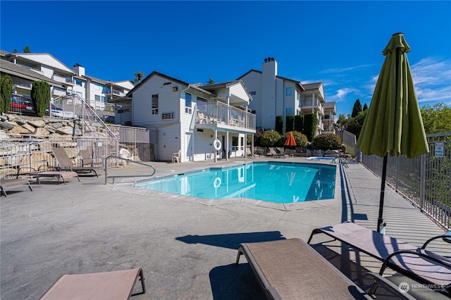 view of swimming pool with a patio