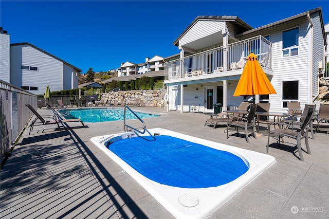 view of swimming pool featuring a patio area