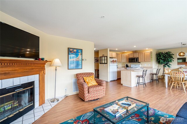 808 W Manson Rd Unit B204, Chelan, WA 98816 - living area with a fireplace, light wood-style floors, baseboards, and recessed lighting