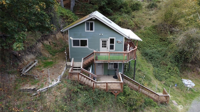 back of property featuring a wooden deck