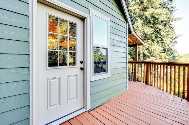 entrance to property with a deck