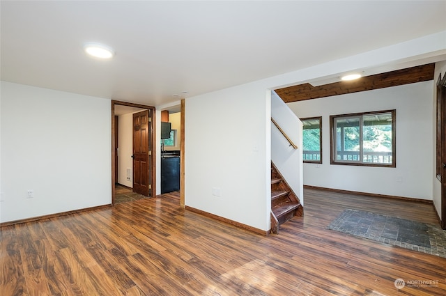 unfurnished room featuring dark hardwood / wood-style floors