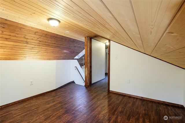 bonus room featuring lofted ceiling, dark hardwood / wood-style floors, and wooden ceiling