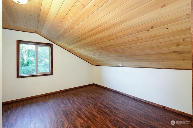 additional living space with dark wood-type flooring, wood ceiling, and vaulted ceiling