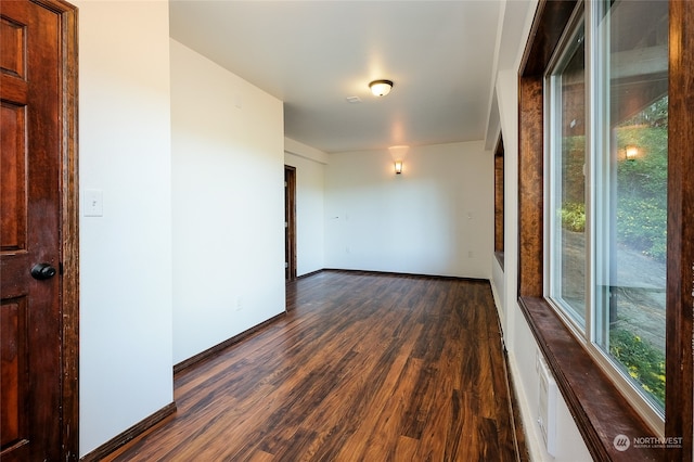 empty room featuring dark hardwood / wood-style floors