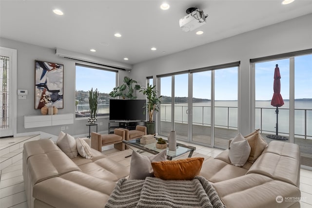 tiled living room featuring plenty of natural light