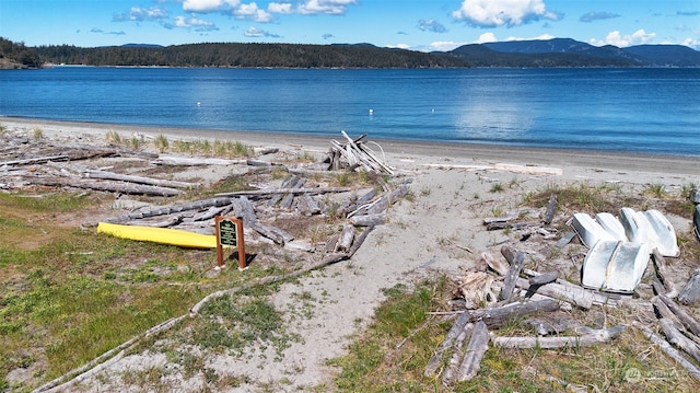 view of water feature with a view of the beach and a mountain view