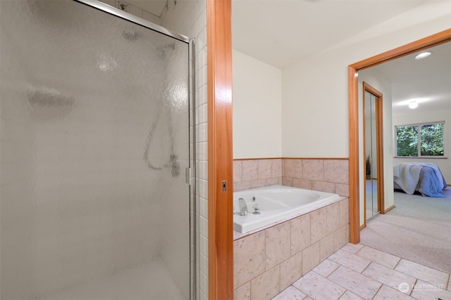 bathroom featuring separate shower and tub and tile patterned flooring